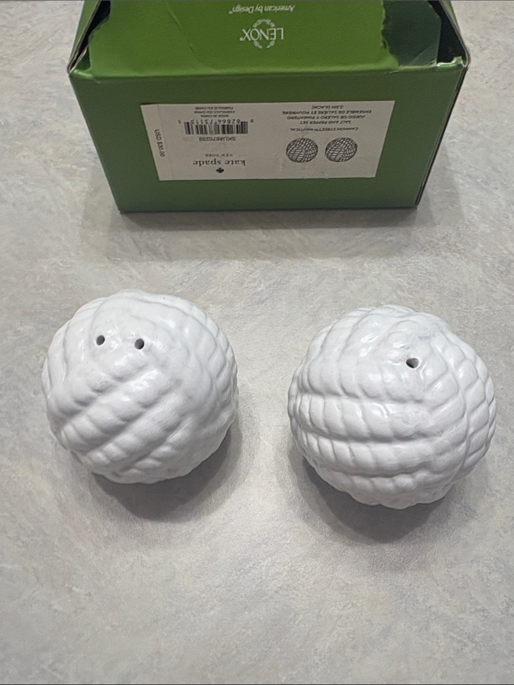 Kate Spade White nautical salt and pepper shakers.